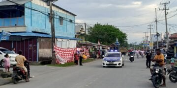 Semangat Merah Putih Membara, Sat Lantas Polres Sarmi Kawal Gerak Jalan HUT ke-81 RI